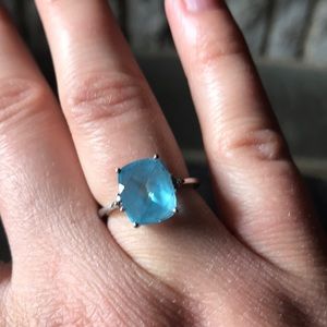 White gold and blue topaz cushion cut ring